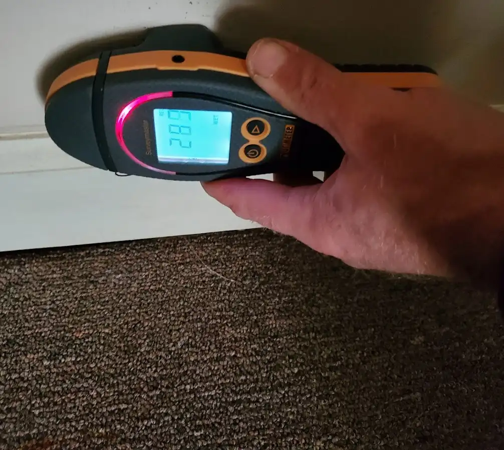 Moisture detection at baseboard during Storm Damage Restoration in Butler